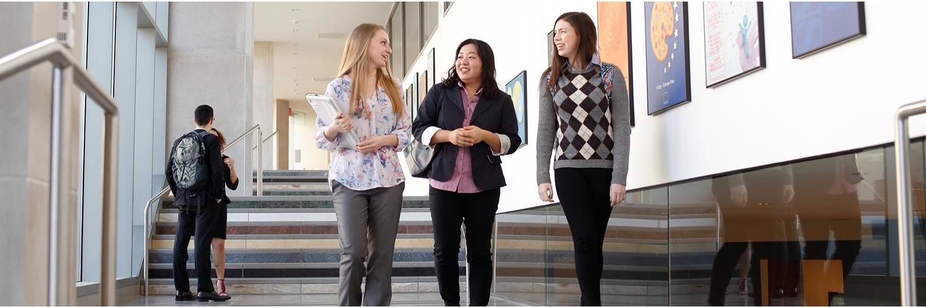 Students standing by the stairs at HLS.