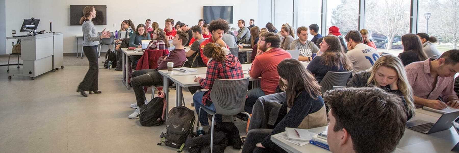 A classroom of students is being taught.