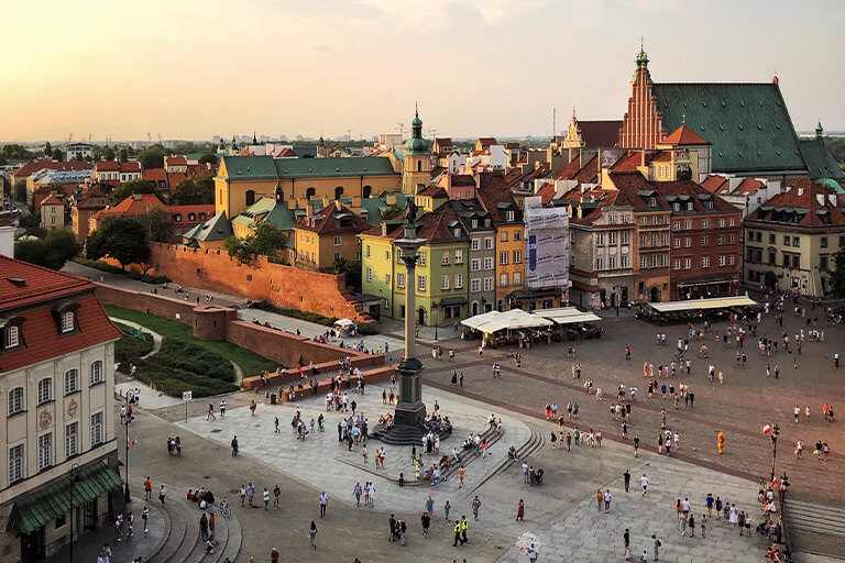 People in a town square in Warsaw, Poland.