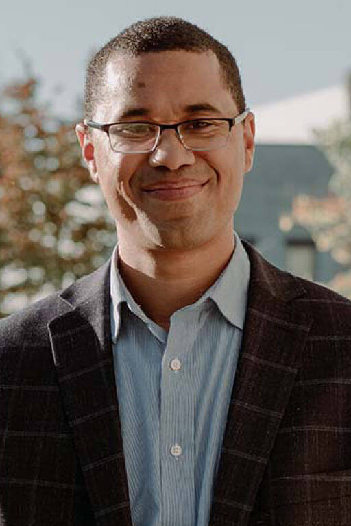 Isak Nti-Asare smiling for the camera.